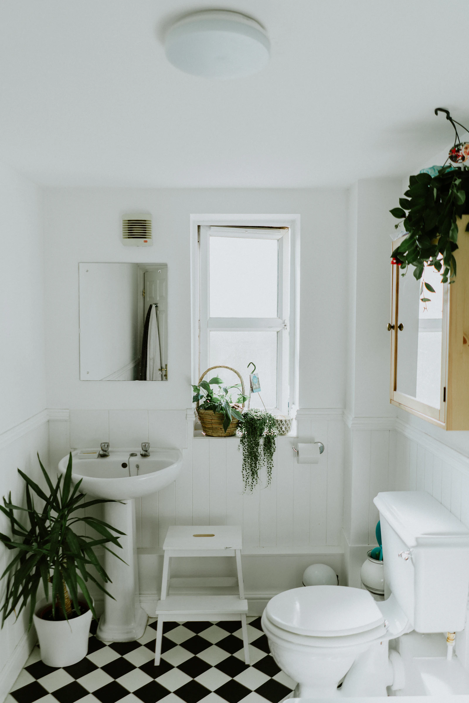 A freshly deep cleaned bathroom with clear shower glass and shining fixtures